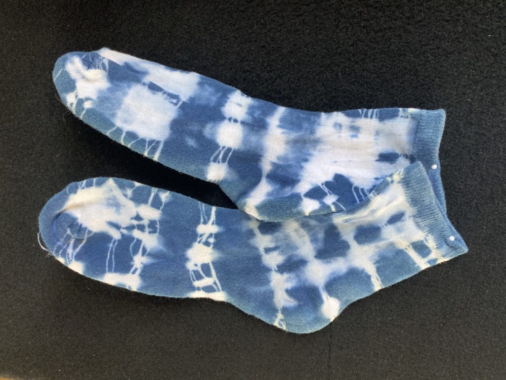Photo of socks that have been indigo tie dyed